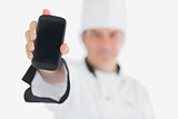 Chef displaying smartphone
