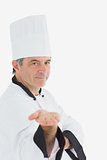 Male chef presenting an invisible product