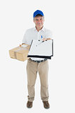 Courier man with package holding out clipboard