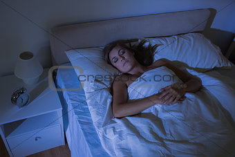 Calm woman sleeping at night