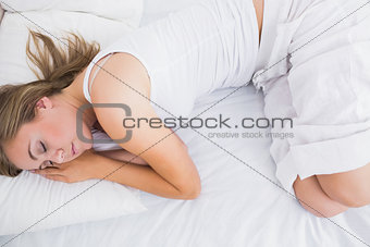 Woman sleeping in the white pyjama