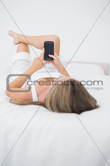 Quiet woman looking at her phone
