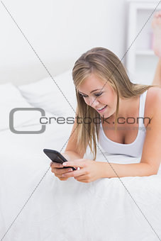 Blonde woman using her phone