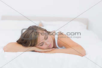 Blonde woman napping on the bed