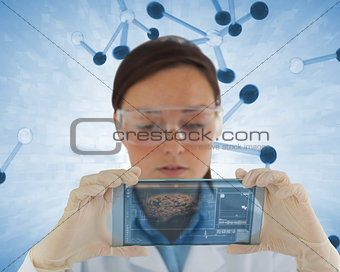 Focused nurse holding a virtual screen