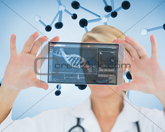 Smiling nurse holding a virtual screen
