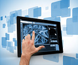 Hand touching a digital tablet on a digitally generated background