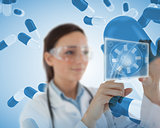 Smiling laboratory workers holding a virtual screen