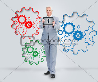 Mature business man presenting tablet