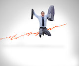 Successful businessman jumping against a background