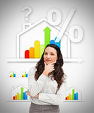 Woman standing against energy efficient house graphic