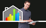 Man standing behind energy efficient house graphic