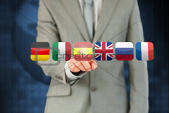 Businessmans finger activating state flags on touchscreen