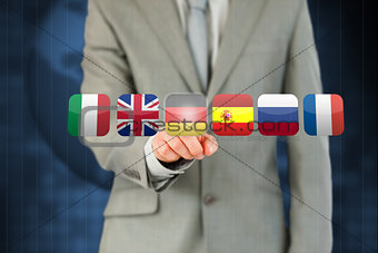 Businessman activating German flag on touchscreen
