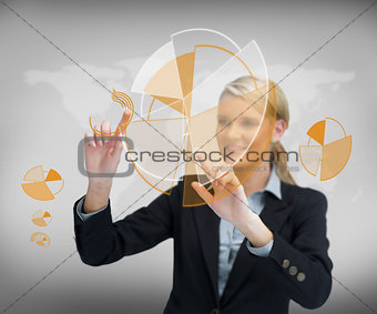 Smiling businesswoman working with graphs