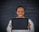 Smiling businesswoman holding a tablet