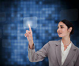 Businesswoman pressing button on touch screen against a background