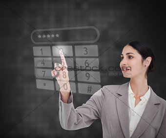 Businesswoman using touch screen against a background