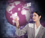 Businesswoman working with envelopes on touch screen