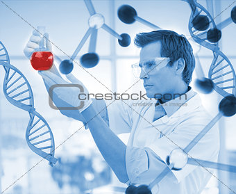 Scientist examining a beaker
