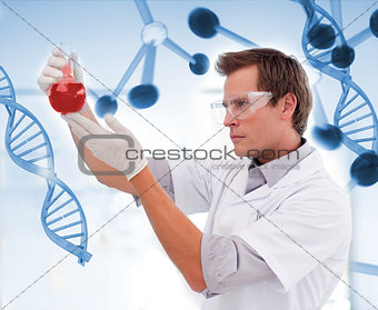 Biologist examining a beaker of blood