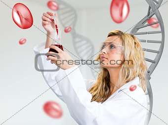 Female scientist examining blood