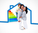 Smiling family standing with a blue house illustration with energy rating graphic
