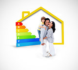 Smiling family standing with a yellow house illustration with energy rating