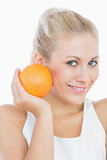 Happy young woman with orange