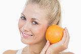 Happy woman with fresh orange