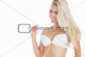Sexy woman pulling off bra strap