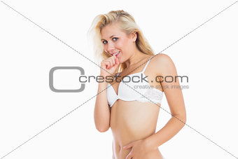 Shy woman in white bra