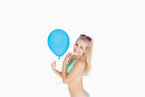 Portrait of woman holding balloon
