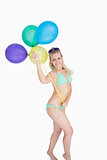 Happy woman holding balloons