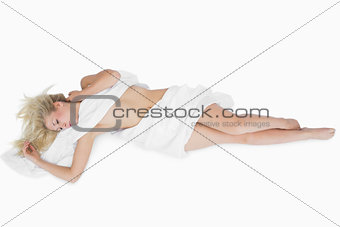 Woman wrapped in cloth relaxing on floor