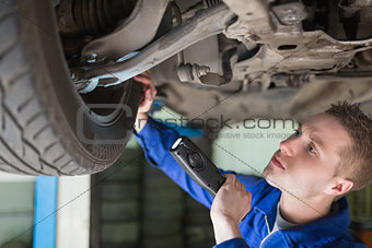 Mechanic examining tire