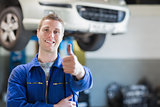 Male mechanic giving thumbs up