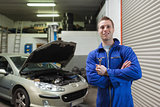 Confident male mechanic with spanner