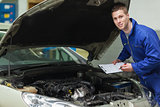Mechanic analyzing car engine