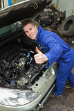 Auto mechanic showing thumbs up sign
