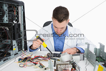 Young computer engineer working on cpu parts