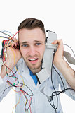 Closeup portrait of it professional yelling with cables in hands