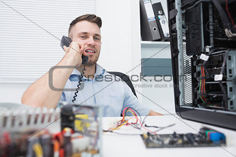 Hardware professional sitting by an open cpu while on call