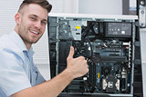 Hardware professional gesturing thumbs up by open cpu