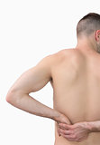 Rear view of shirtless man with backache
