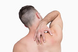 Rear view of shirtless man with neck pain