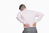 Rear view of business man with back pain