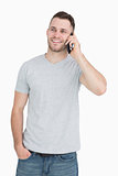 Casual young man using mobile phone