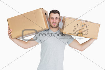 Portrait of tired young man carrying package boxes
