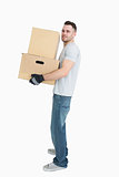 Portrait of young man carrying package boxes